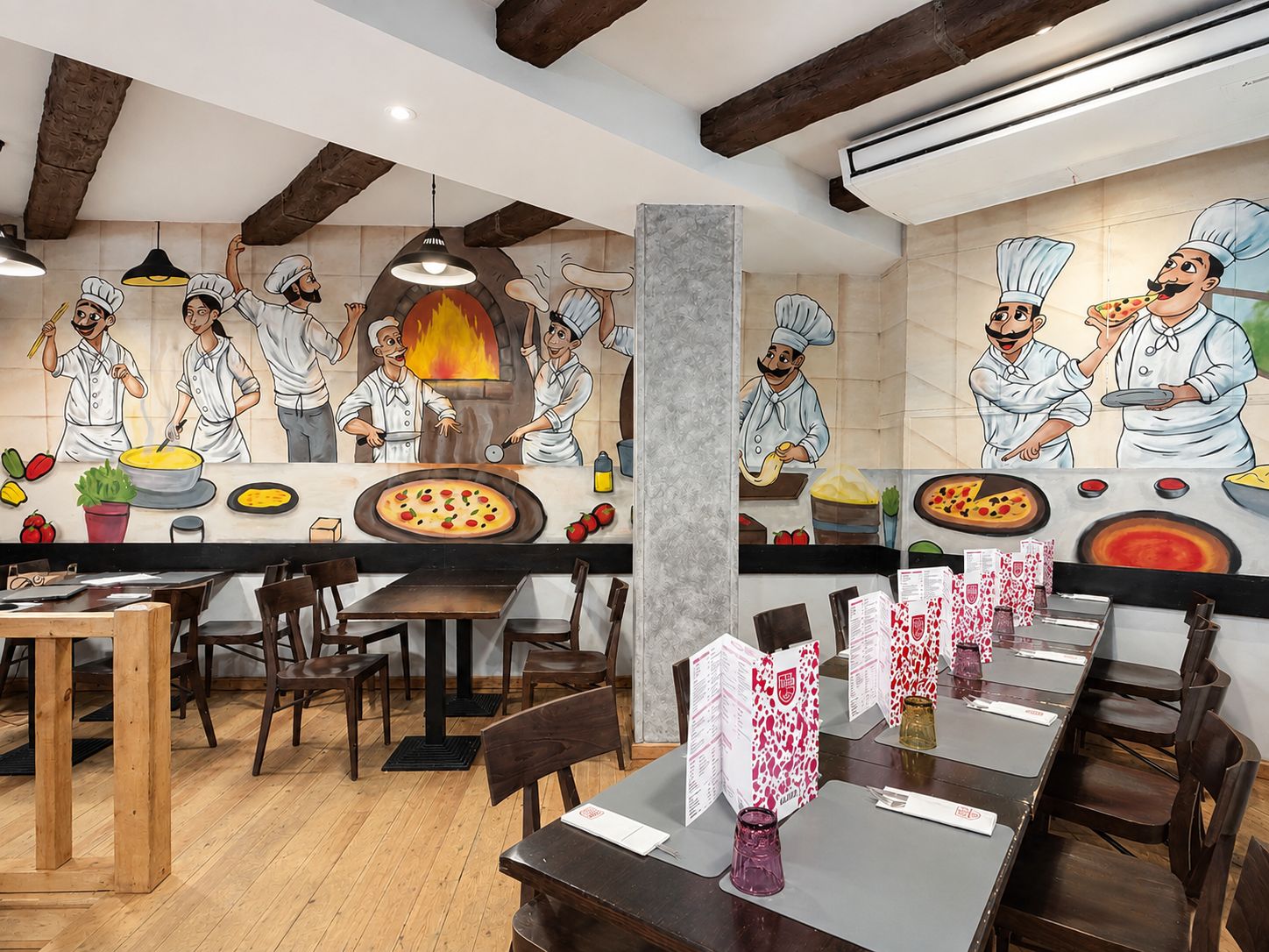Mural del equipo de pizzaiolos en La Piazza